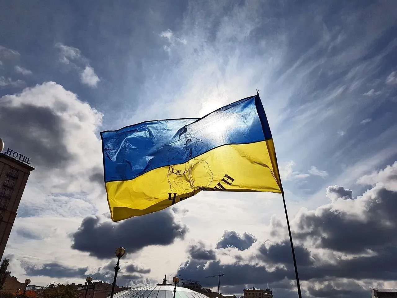 Ukraine flag waving amidst the blue sky