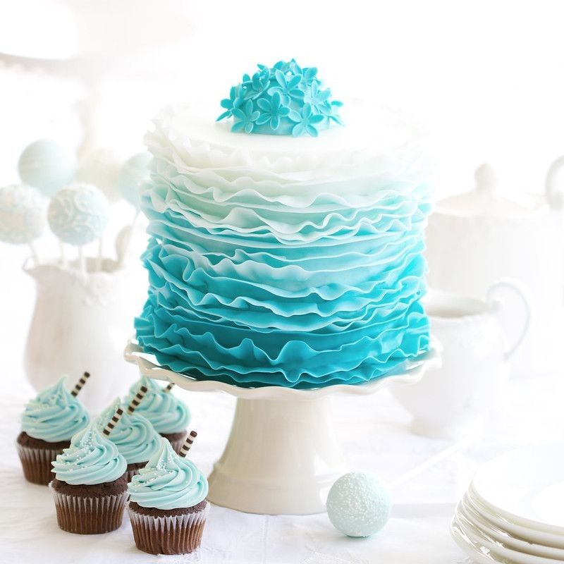 Ombre ruffle cake on a dessert table