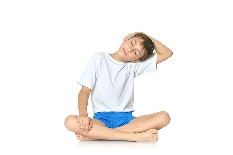 Child stretching out during yoga