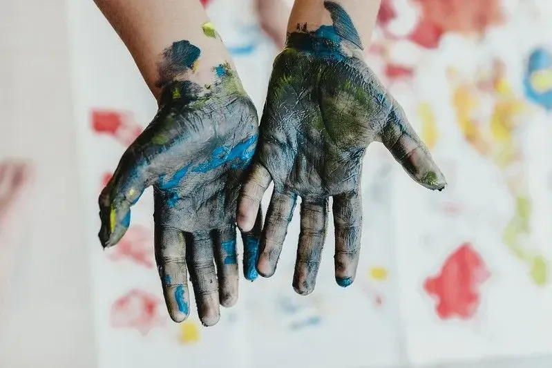Child's mucky hands that look like the Earth