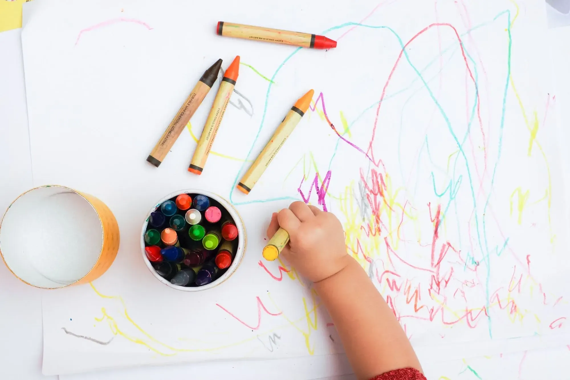 toddler's hand drawing with crayon