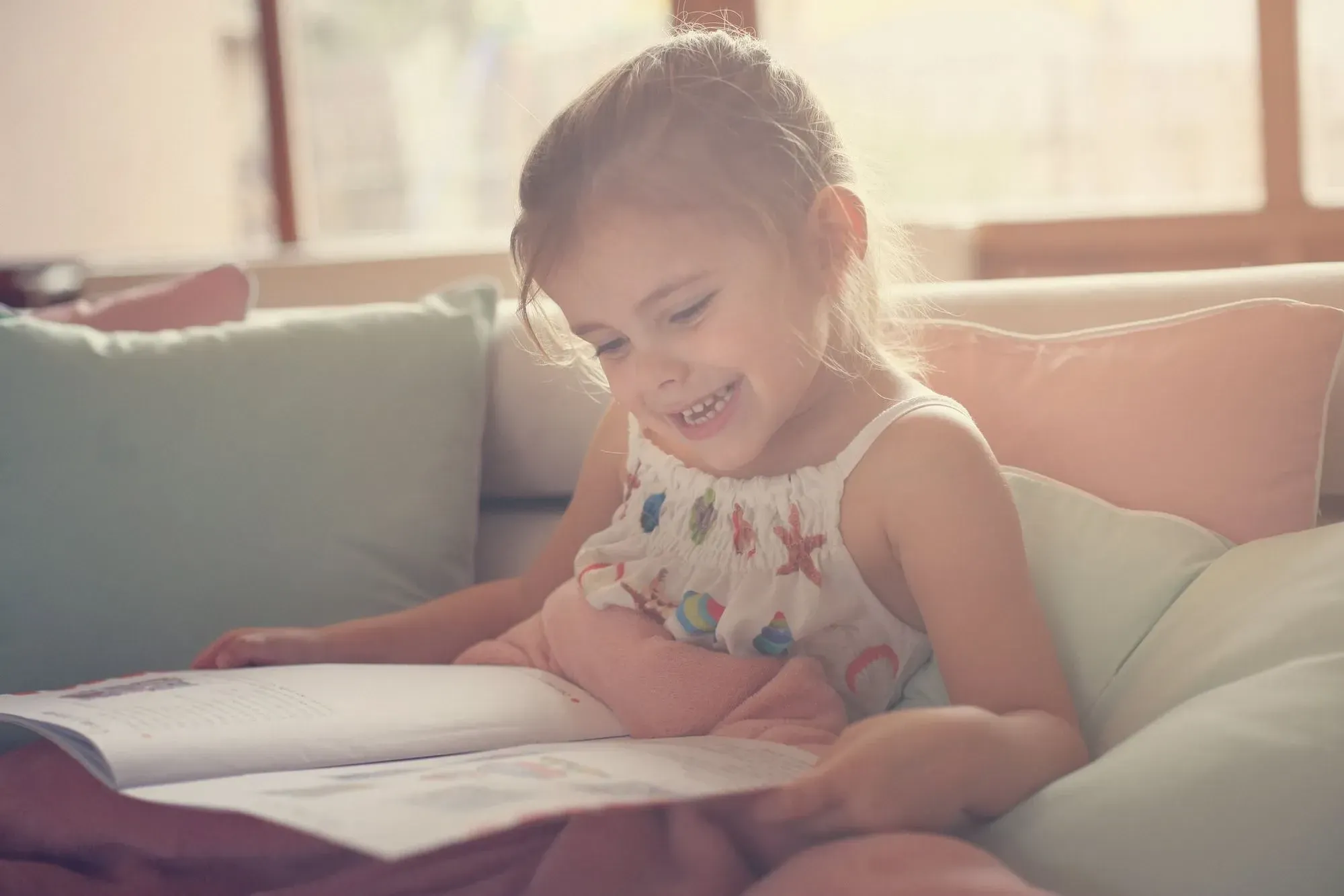 little girl enjoying her book