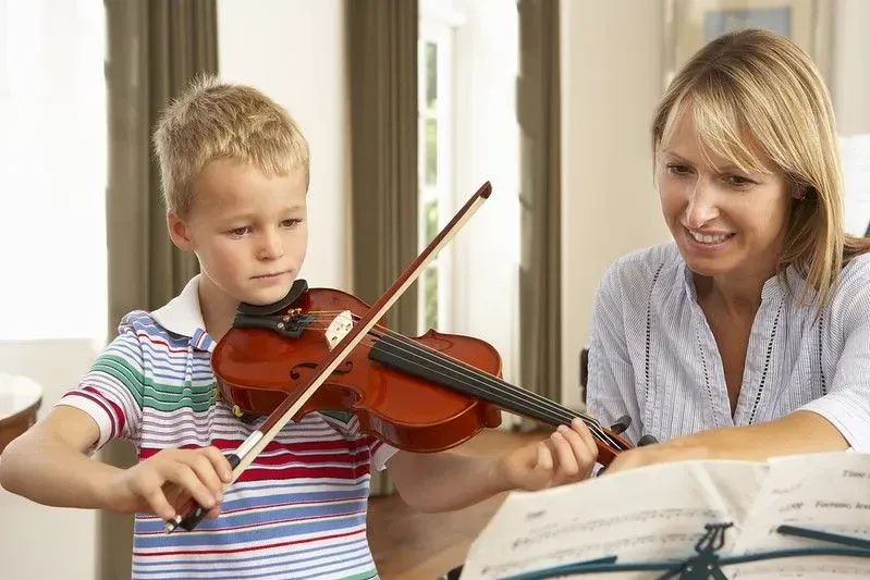 Child learning violin