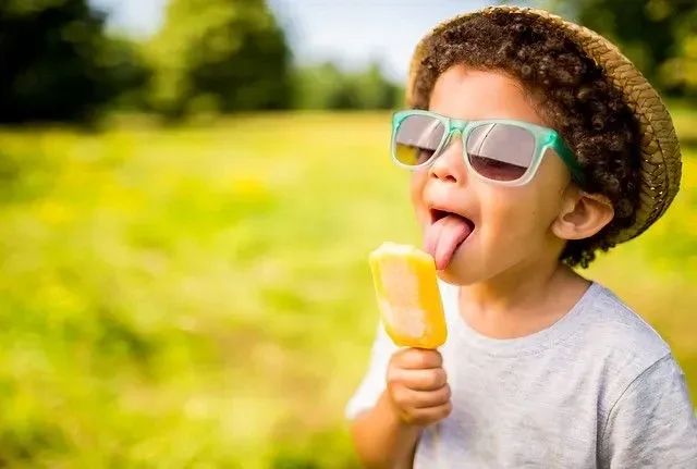 Little child eating ice cream.