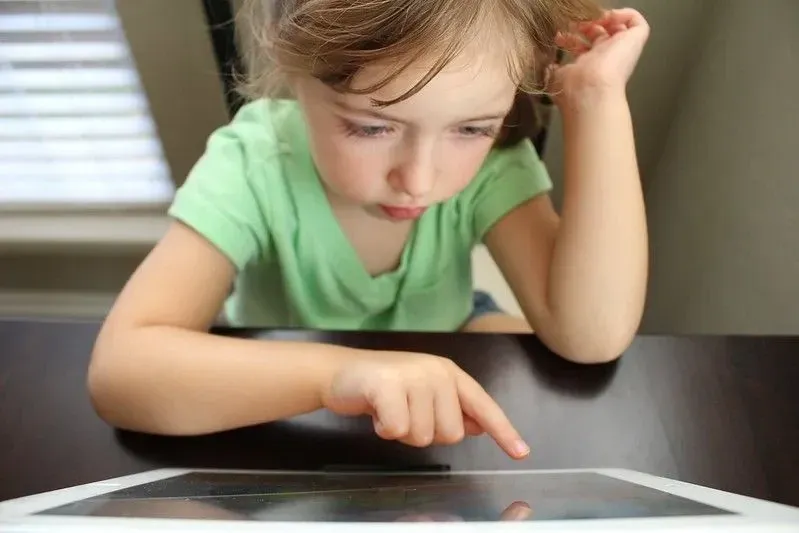 Young girl watching a great YouTube video for kids.