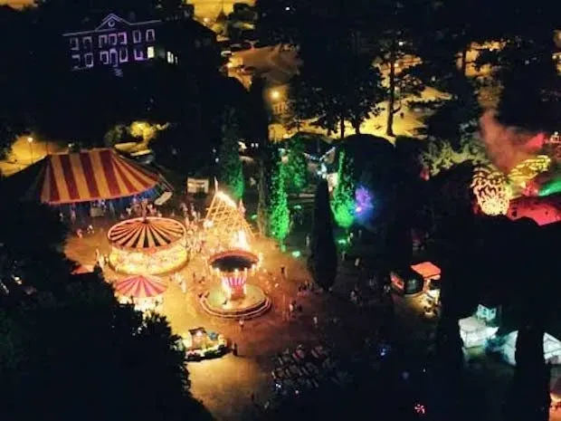ariel view of enchanted horsham's fairground at night