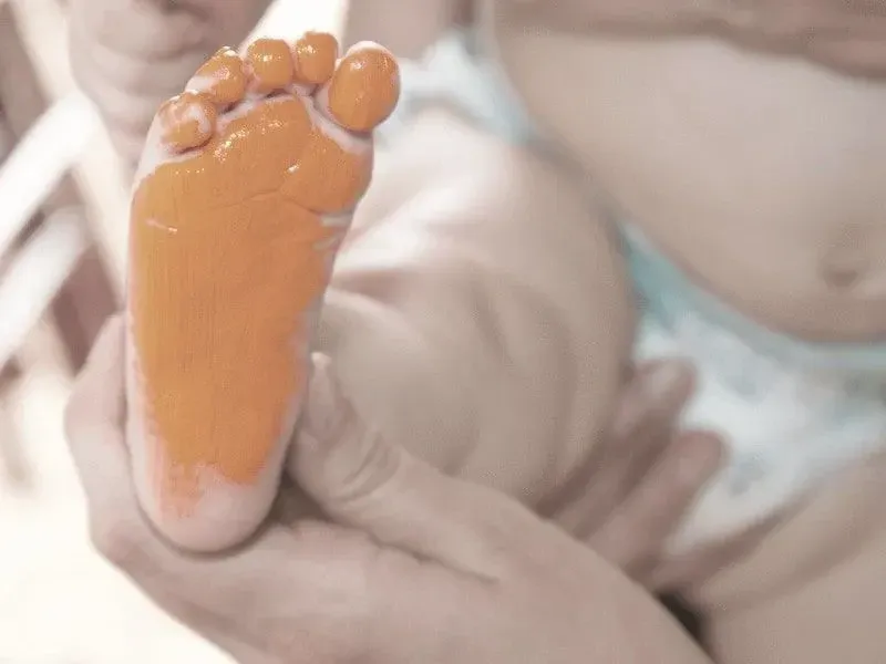 Painted baby foot to create a foot print ornament.