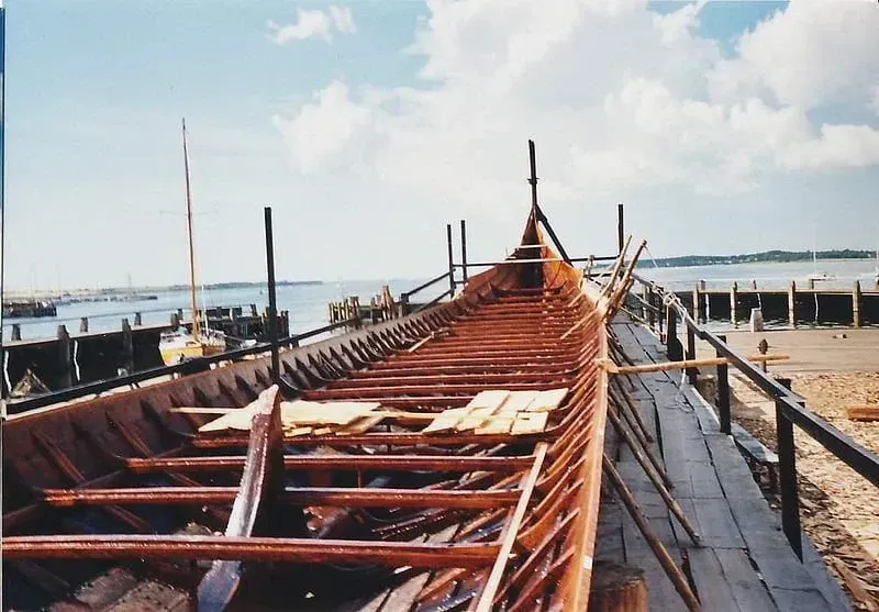 View of a Viking longship with the benches inside visible.