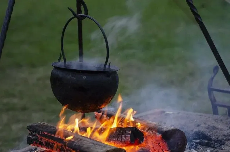 Viking cauldron pot hanging over a hot fire.