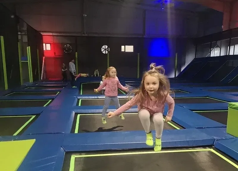 Two little girls bouncing at Jump In Enfield.