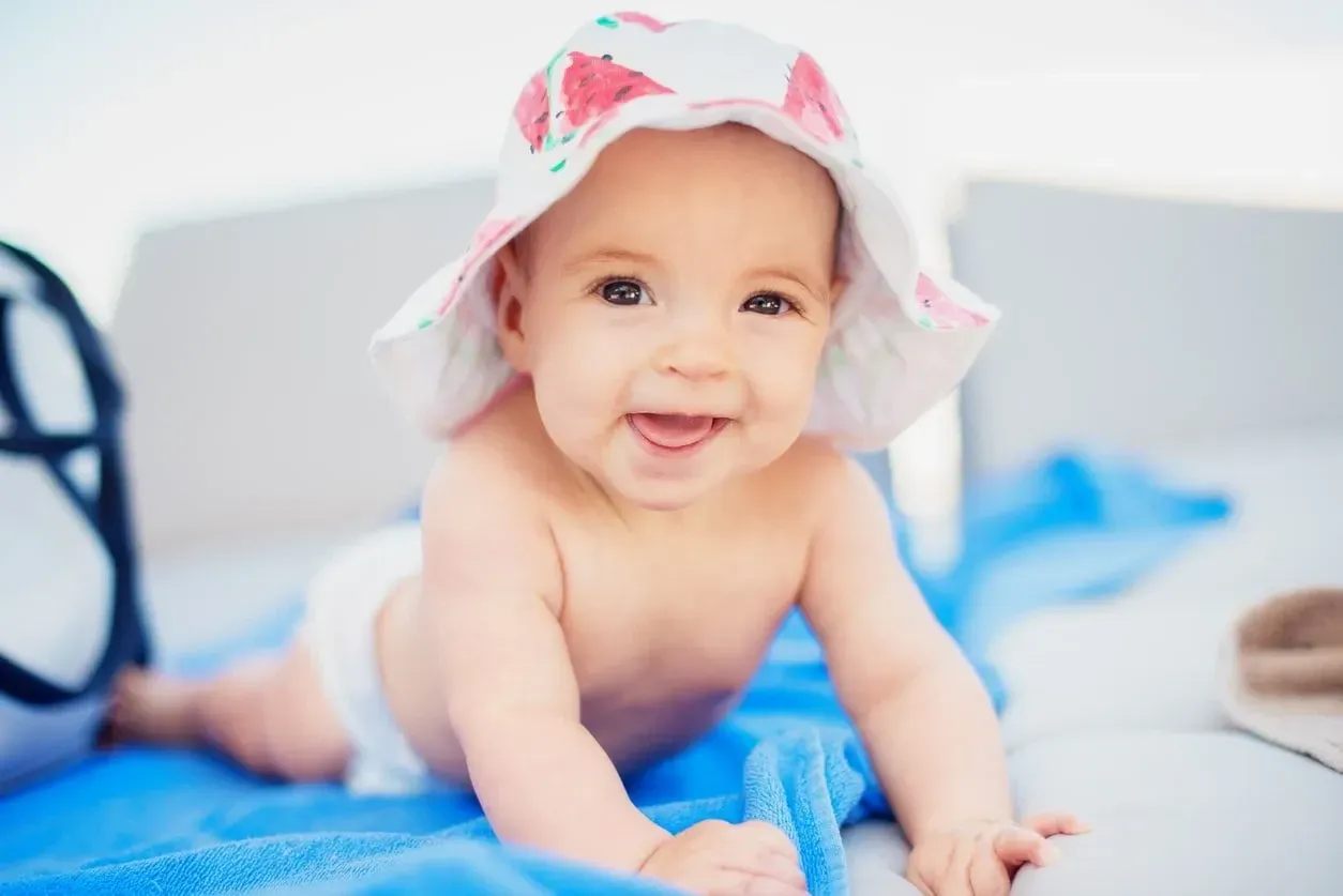 Baby wearing baby sun hat