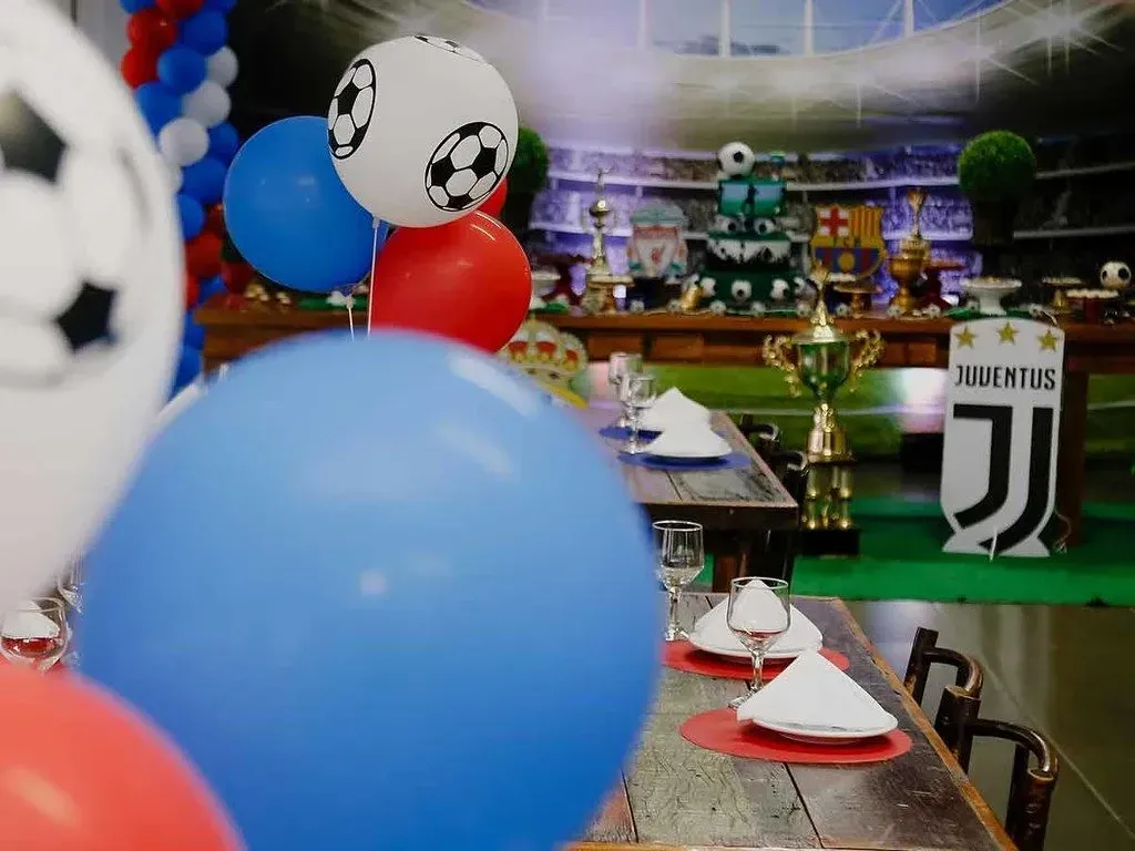Balloons and decorations at a sports themed birthday party.