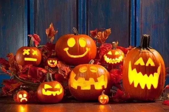 Carving spooky smiley faces into pumpkins is a fun and traditional family Halloween activity.