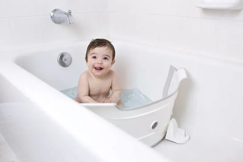 Baby enjoying their time in baby bath. 