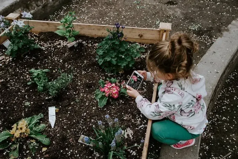 Girl doing gardening from set. 