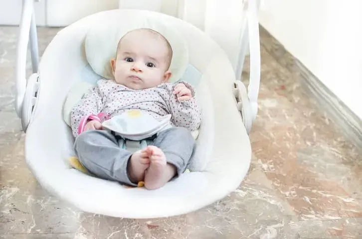 Baby relaxing in soothing bouncer. 