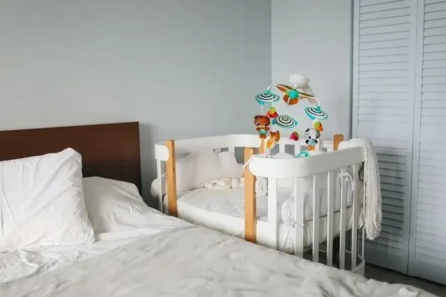 Where is your crib set up? This might be the reason your little one won't sleep through the night