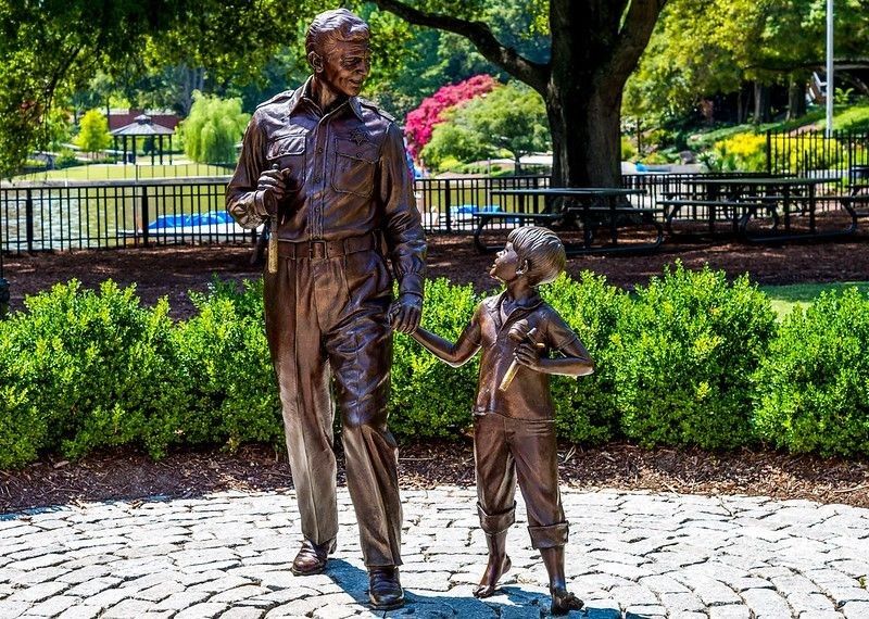 Statues of Andy Griffith and young Ron Howard at Pullen Park in Raleigh, NC