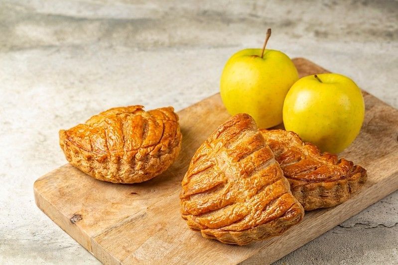 Apple turnovers are a classic French puff pastry that is filled with apple sauce.