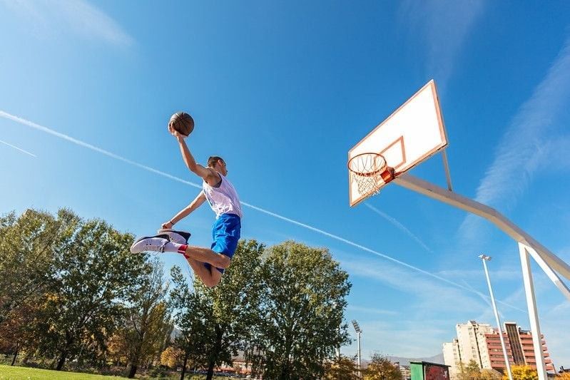 Basketball Player making a slam dunk