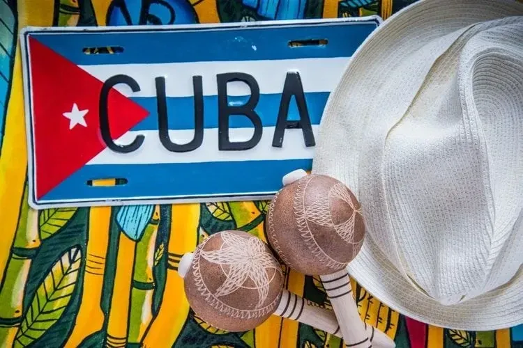 Cuban flag with Panama hat and macaras