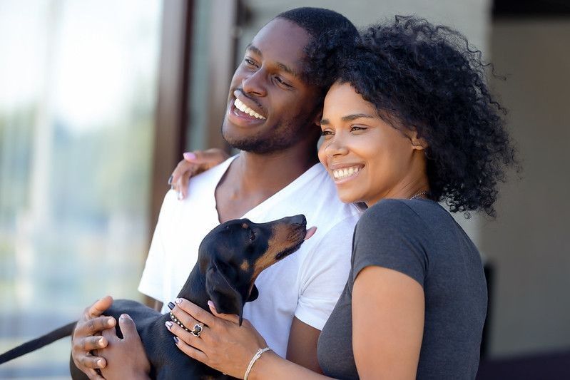 happy couple with a dog