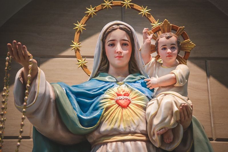 Statue of Our lady and child Jesus in catholic church.