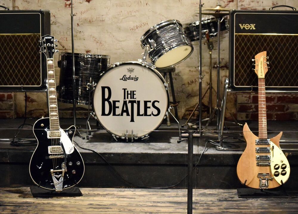 The Beatles stage with musical instruments
