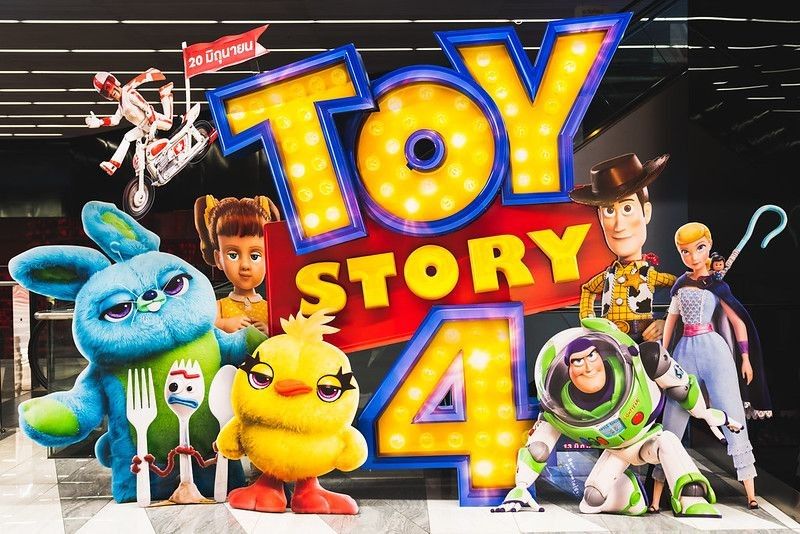 Toy Story 4 movie backdrop display with cartoon characters in movie theatre