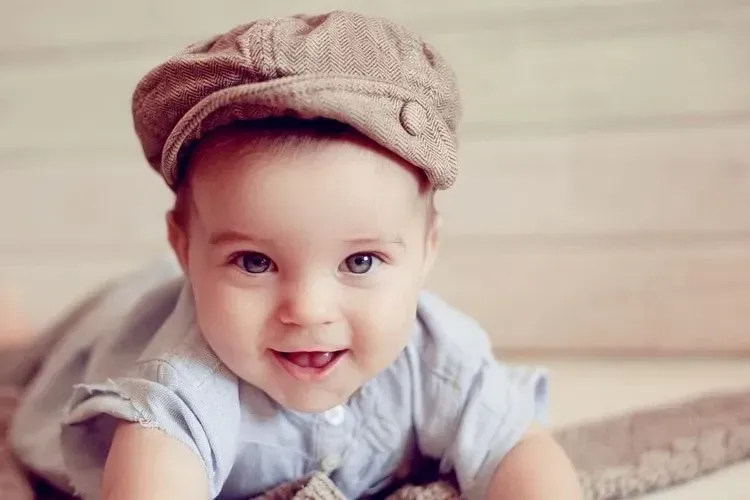 A cute newborn baby wearing a hat