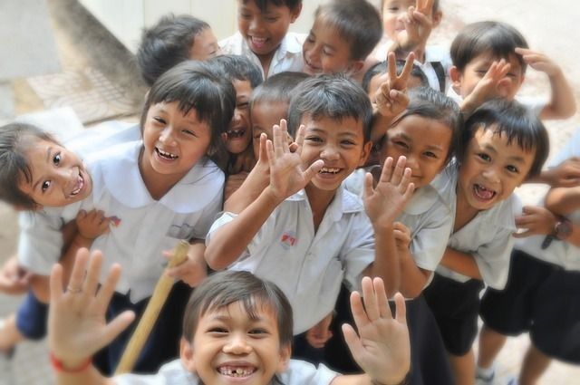 Cute school kids smiling at camera