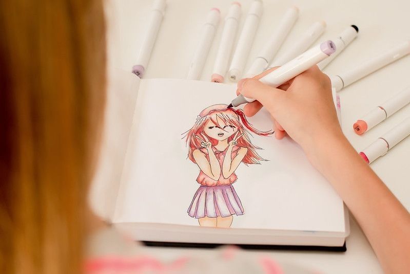 Artist drawing a female anime character