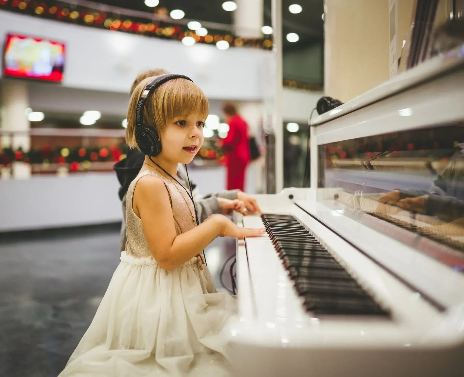 A little girl playing piano