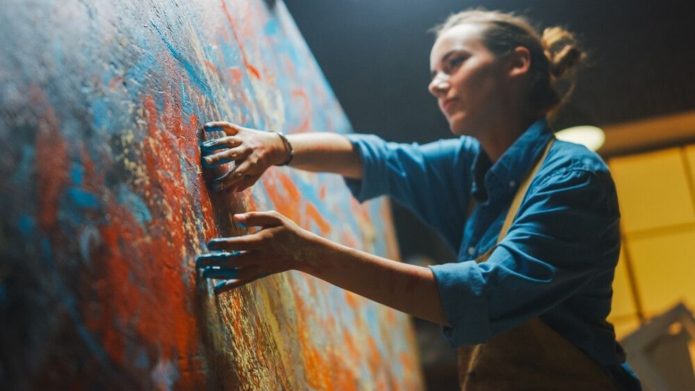 Talented Innovative Female Artist Draws with Her Hands on the Large Canvas