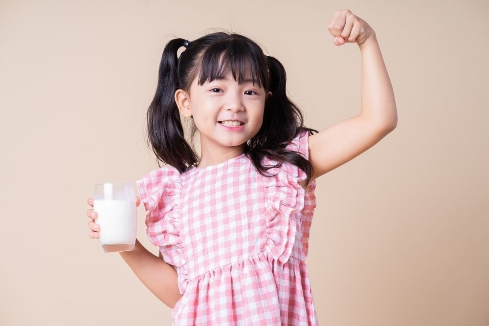 Asian child drinking milk
