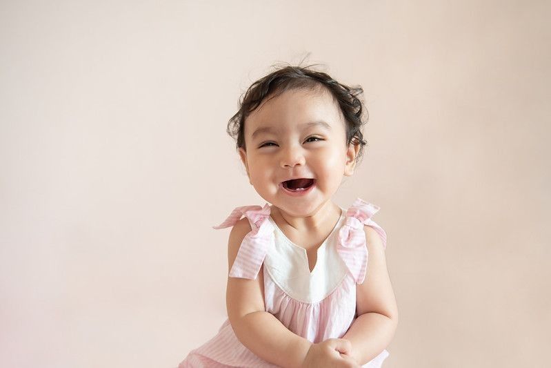 Portrait of a cute happy little baby girl