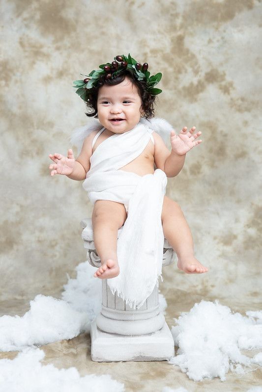 Baby girl dressed as a Greek Goddess
