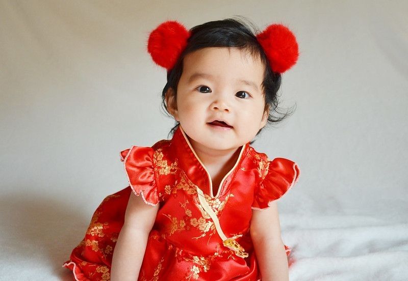 Asian Newborn baby girl in traditional dress