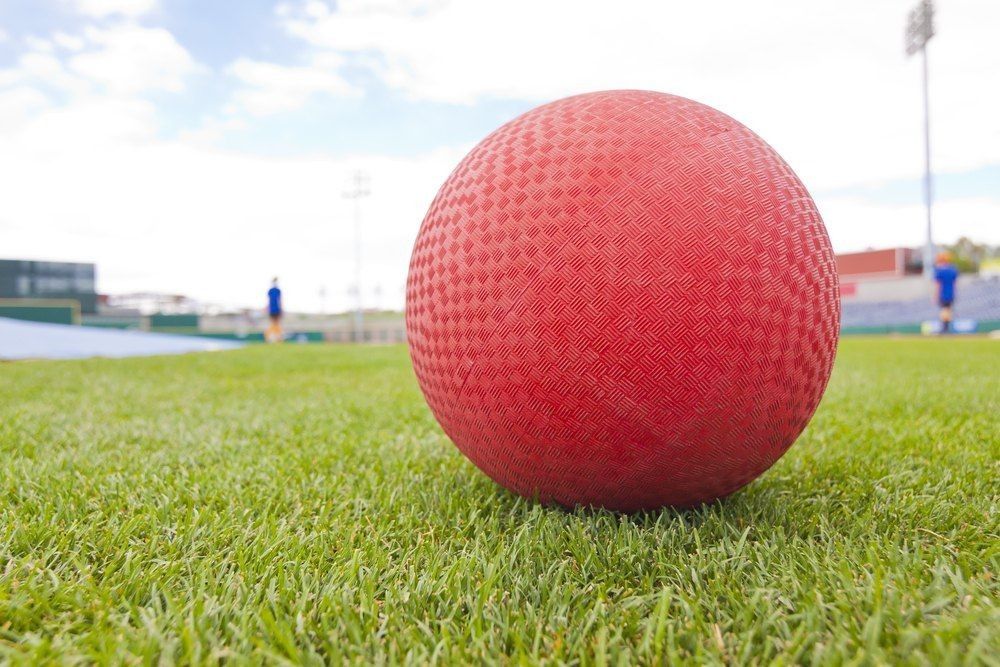 Red Ball on grass field