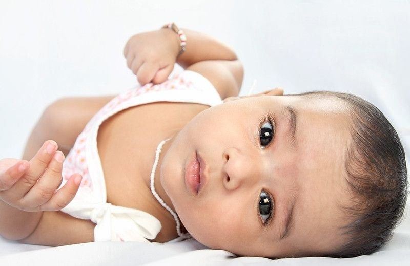 Cute newborn baby looking at the camera.