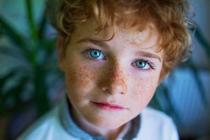 Close up of boy's face having blue eyes