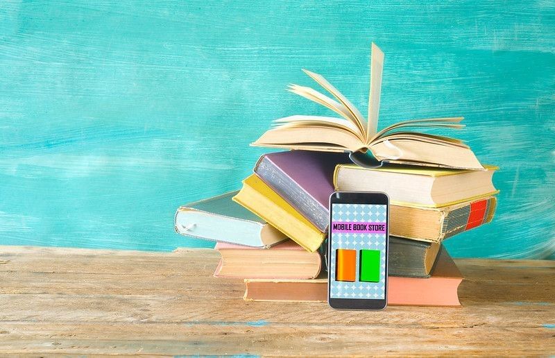 Stack of books and smartphone