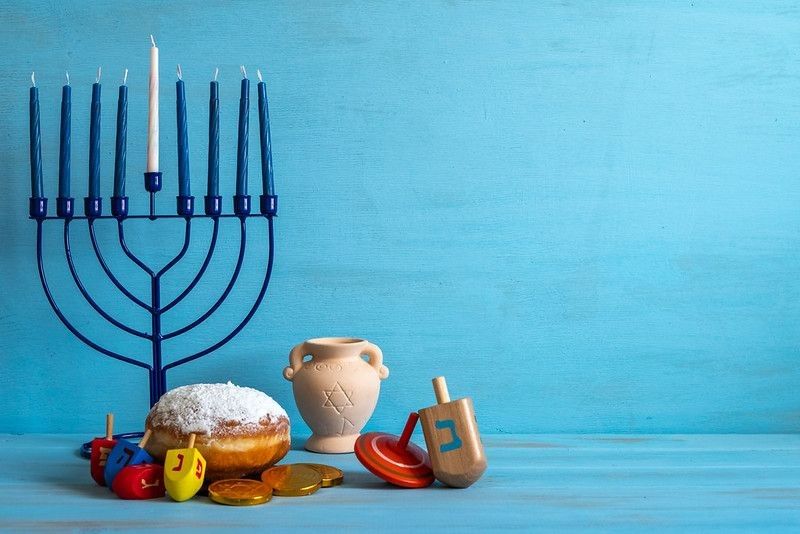 Candles placed on stand with blue background.