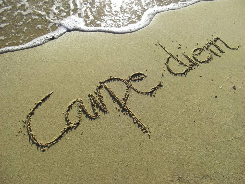 Carpe Diem Phrase in Sand on the Beach