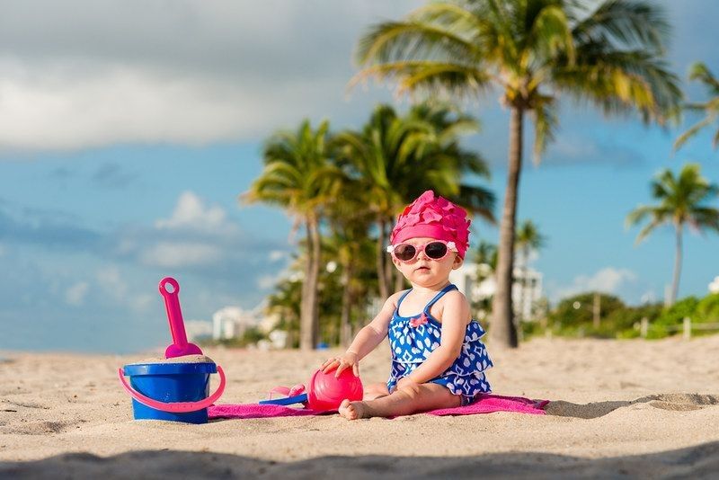 Cute Girl playing on Beach