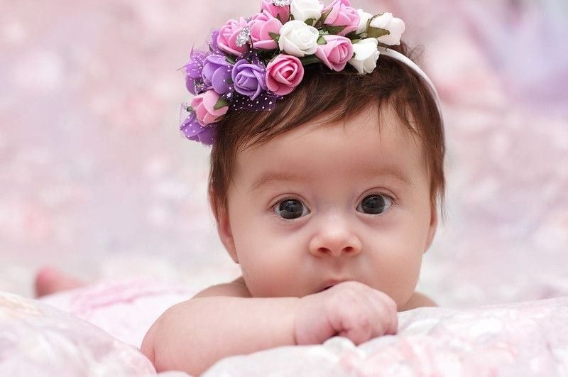 Cute little girl in a floral chaplet