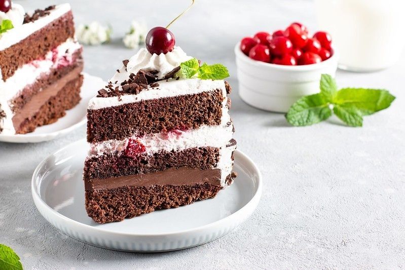 A delicious slice of Black Forest Cake on a plate.