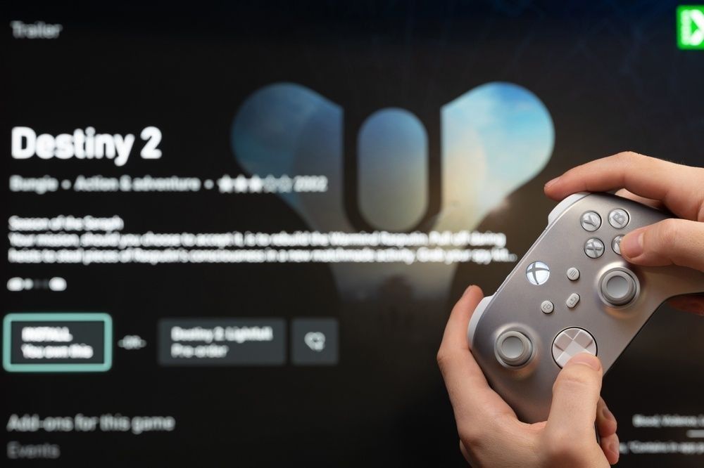 Gamer start new Destiny 2 Game on xbox console with joystick in hand