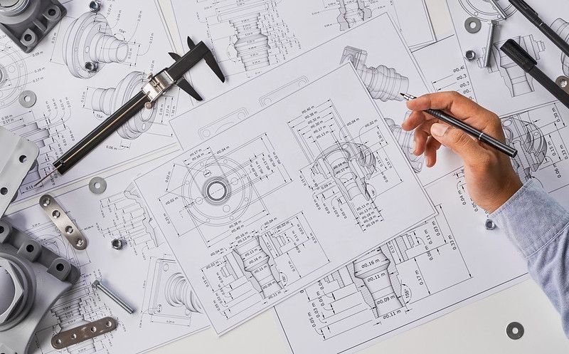 Engineer technician designing drawings for manufacturing