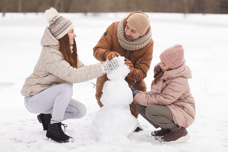 Family making snowman